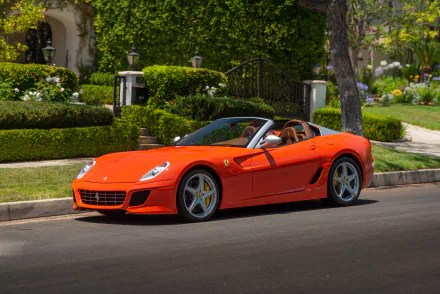 A vibrant orange Ferrari SA Aperta supercar parked on a residential street, captured in stunning 4K Ultra HD for a PC desktop wallpaper.