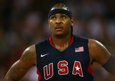 HD desktop wallpaper featuring an athlete in a USA basketball uniform with a focus on determination.