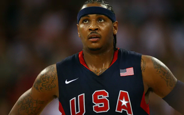 HD desktop wallpaper featuring an athlete in a USA basketball uniform with a focus on determination.