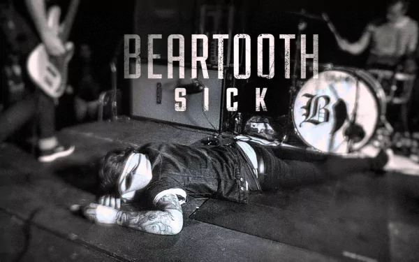 Monochrome HD desktop wallpaper featuring an energetic live performance with the word 'Beartooth' prominently displayed above the band.