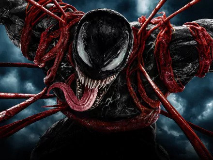 4K Ultra HD Venom desktop wallpaper featuring a close-up of Venom from the movie Venom: Let There Be Carnage, with red symbiote tendrils and a dark, stormy background.