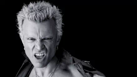HD wallpaper featuring a monochromatic image of a man with spiked hair and a snarl, depicting a rockstar persona, suitable as a desktop background.