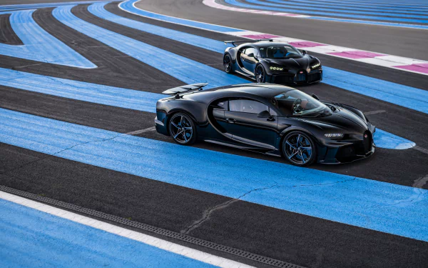 Two black Bugatti Chiron supercars on a blue-striped racetrack, 8K Ultra HD PC desktop wallpaper/background showcasing sleek aerodynamic profiles and glossy reflections.