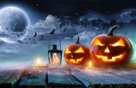 HD PC desktop wallpaper featuring glowing jack-o'-lanterns, a lantern, bats flying under a full moon, and a spooky Halloween holiday night scene.