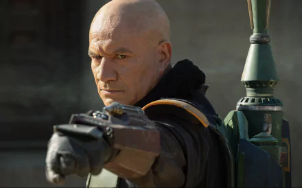 Temura Morrison as Boba Fett from the TV show The Book of Boba Fett, shown aiming a blaster, in a 4K Ultra HD PC desktop wallpaper.