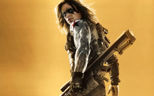 HD desktop wallpaper featuring Sebastian Stan as the Winter Soldier from the movie Captain America: The Winter Soldier, set against a warm golden background.