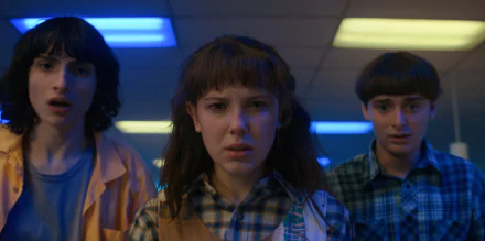 HD PC desktop wallpaper featuring characters from the TV show Stranger Things, with a moody, neon-lit setting and intense expressions.