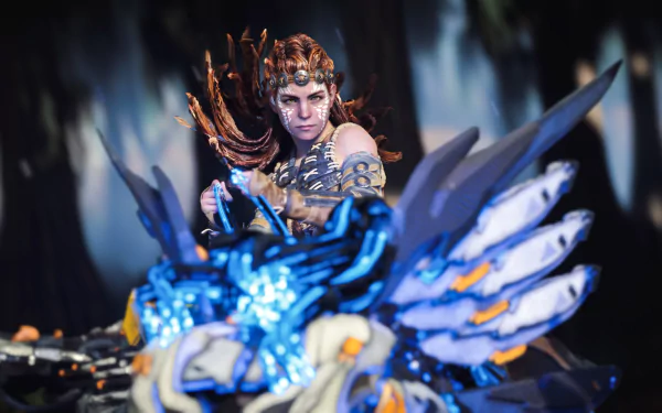 Aloy from Horizon Forbidden West in detailed armor, ready for battle, captured in a 4K Ultra HD video game wallpaper for PC desktop.