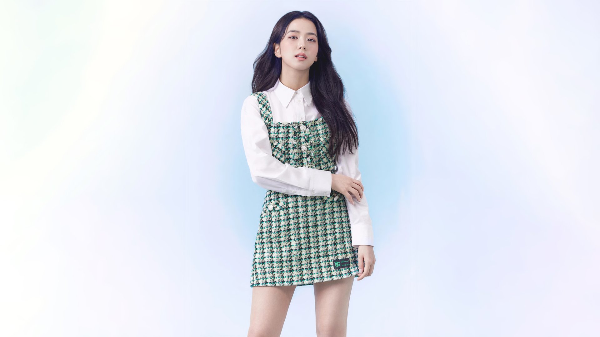 HD desktop wallpaper of Jisoo from BlackPink, showcasing her stylish outfit and confident pose against a clean white background.