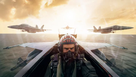 HD PC desktop wallpaper from Top Gun: Maverick — pilot in a cockpit wearing a helmet and oxygen mask, two fighter jets flanking him over the ocean at sunrise.