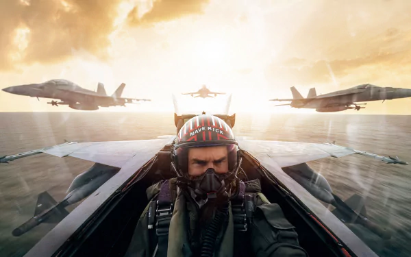HD PC desktop wallpaper from Top Gun: Maverick — pilot in a cockpit wearing a helmet and oxygen mask, two fighter jets flanking him over the ocean at sunrise.