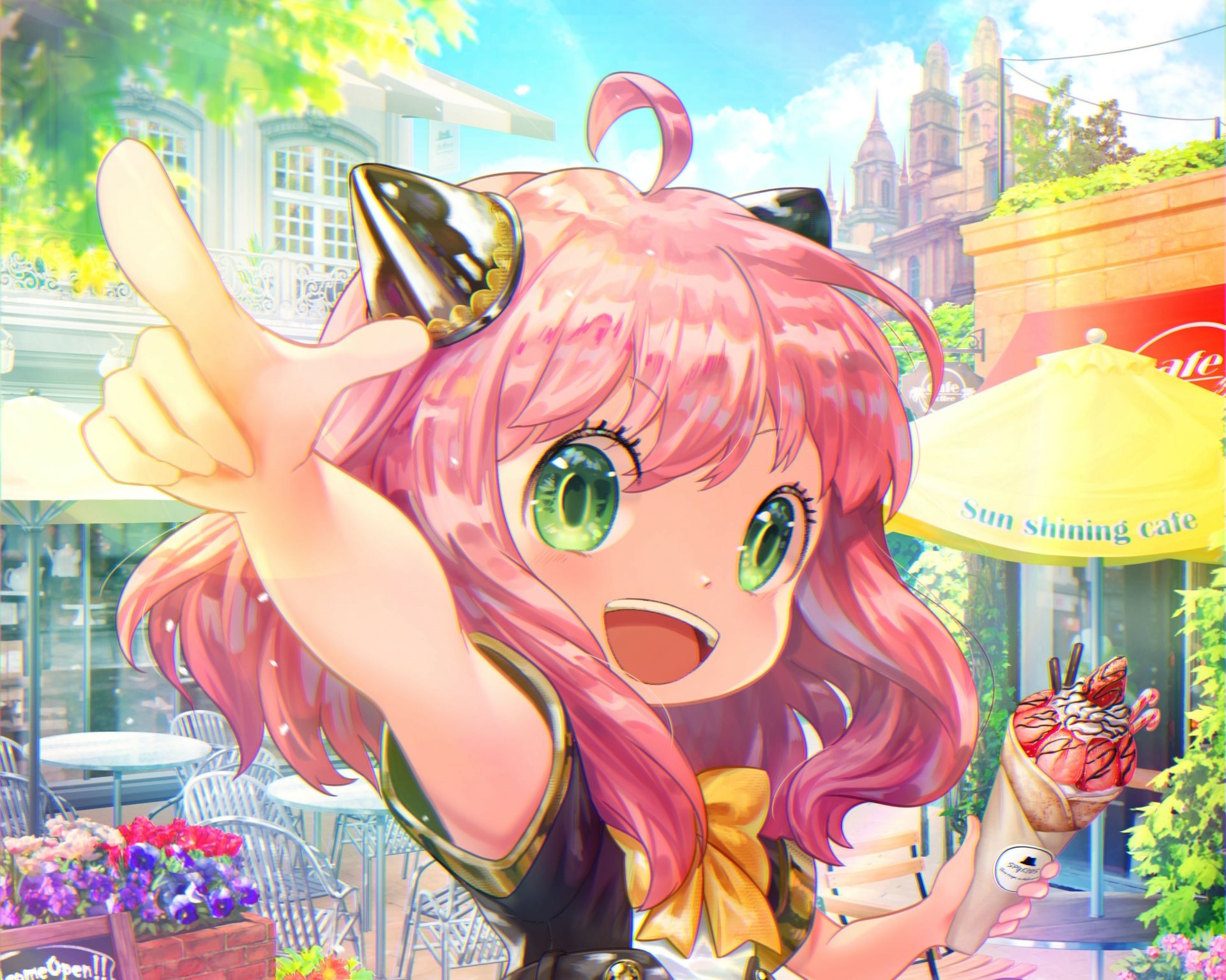 HD PC desktop wallpaper featuring Anya Forger from the anime Spy x Family, showcasing her vibrant pink hair and expressive green eyes in a lively outdoor setting.
