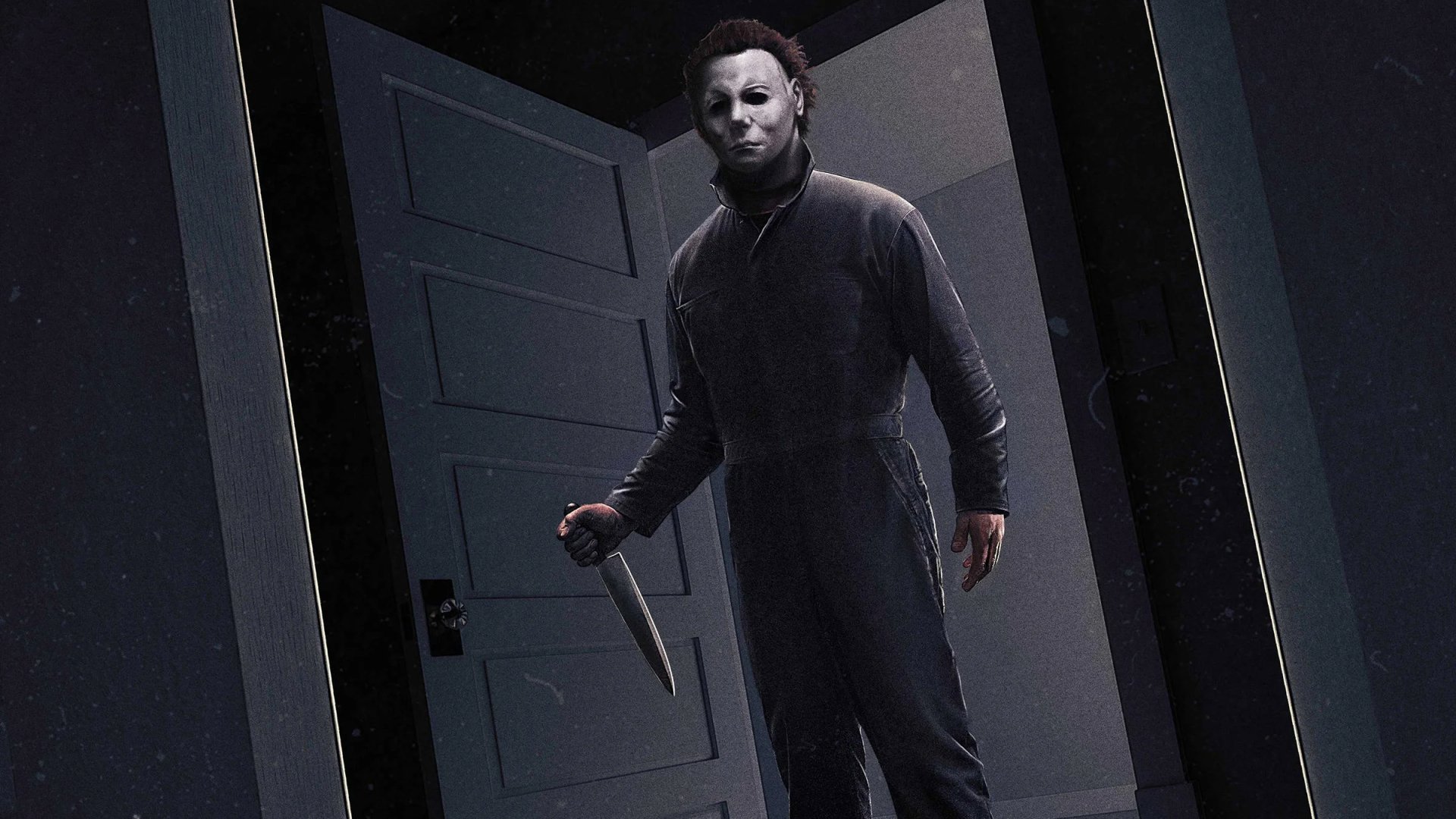 HD PC wallpaper of Michael Myers from the movie Halloween (1978) looming in a dark doorway, pale mask and knife catching cold light.