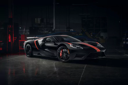 5K Ultra HD PC desktop wallpaper background: sleek black Ford GT vehicle with red stripe parked in a dim garage.