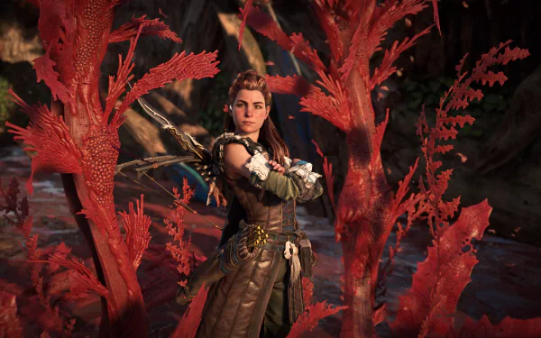 Aloy from the Horizon series stands among crimson Blight flora, poised for battle — 4K Ultra HD PC desktop wallpaper from the video game Horizon Forbidden West.