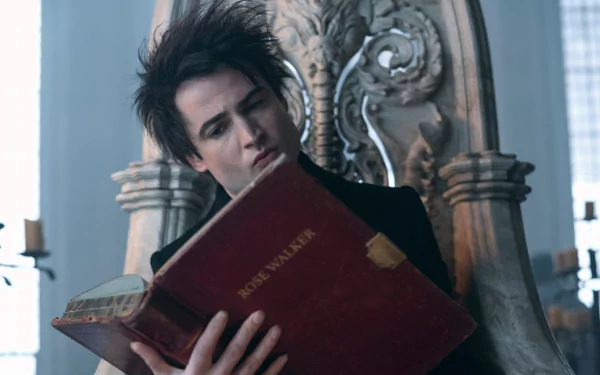 2K Quad HD PC desktop wallpaper: brooding, pale, dark-haired figure from TV show The Sandman reads a large red book while seated on an ornate throne in a dim, gothic room.