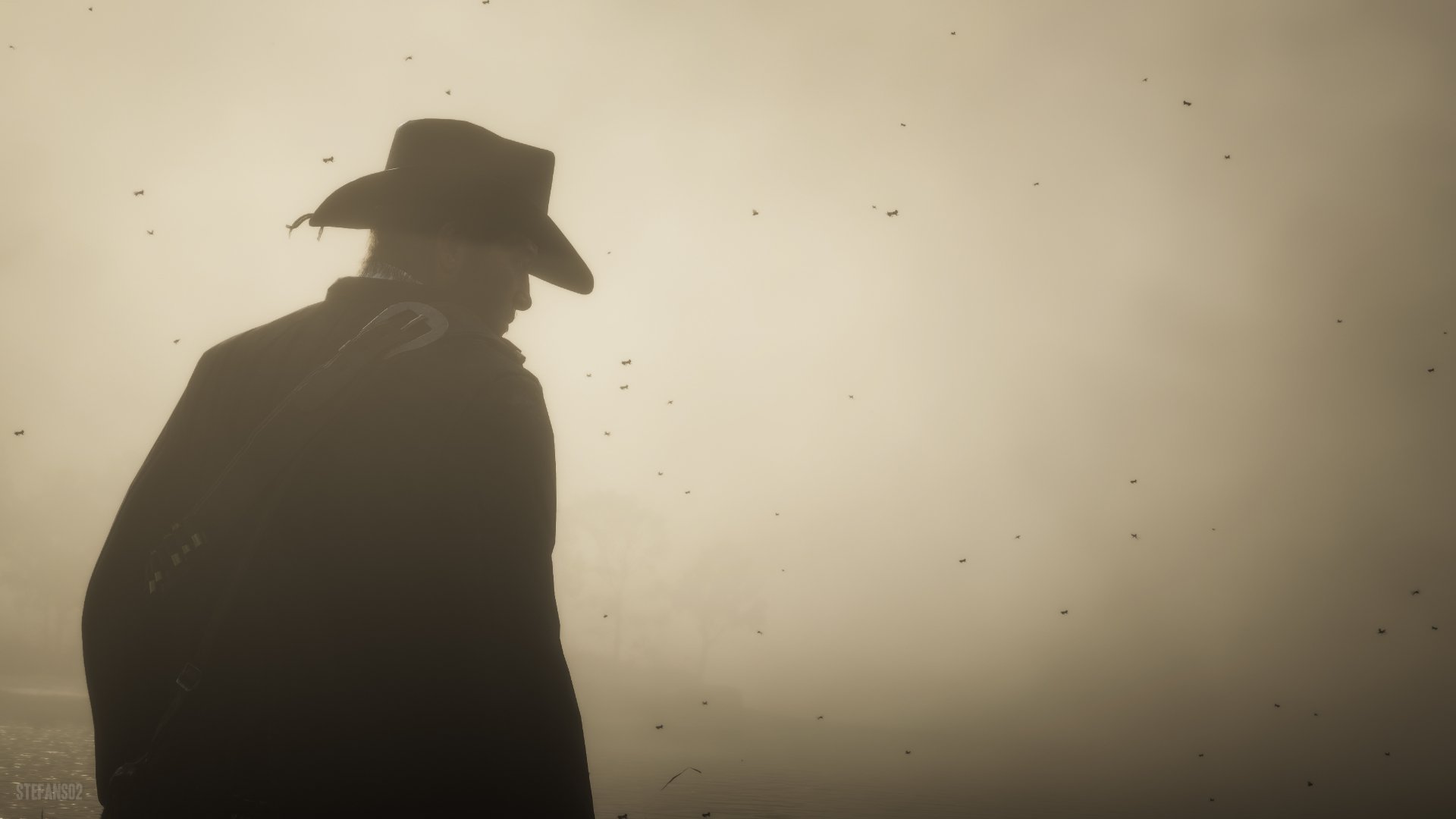 Silhouetted cowboy from Red Dead Redemption 2 against a foggy, muted background, rendered in 4K Ultra HD for a striking PC desktop wallpaper.