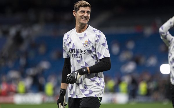 Thibaut Courtois in action for Real Madrid C.F. - a dynamic and powerful sports-themed HD desktop wallpaper and background.