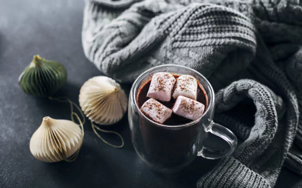A cozy winter desktop wallpaper featuring a delicious cup of hot chocolate, great for setting a warm and inviting atmosphere.