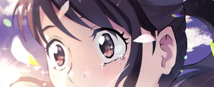 Close-up of Suzume Iwato from Suzume no Tojimari, teary-eyed with floating petals and sparkles — anime 4K Ultra HD PC desktop wallpaper and background.