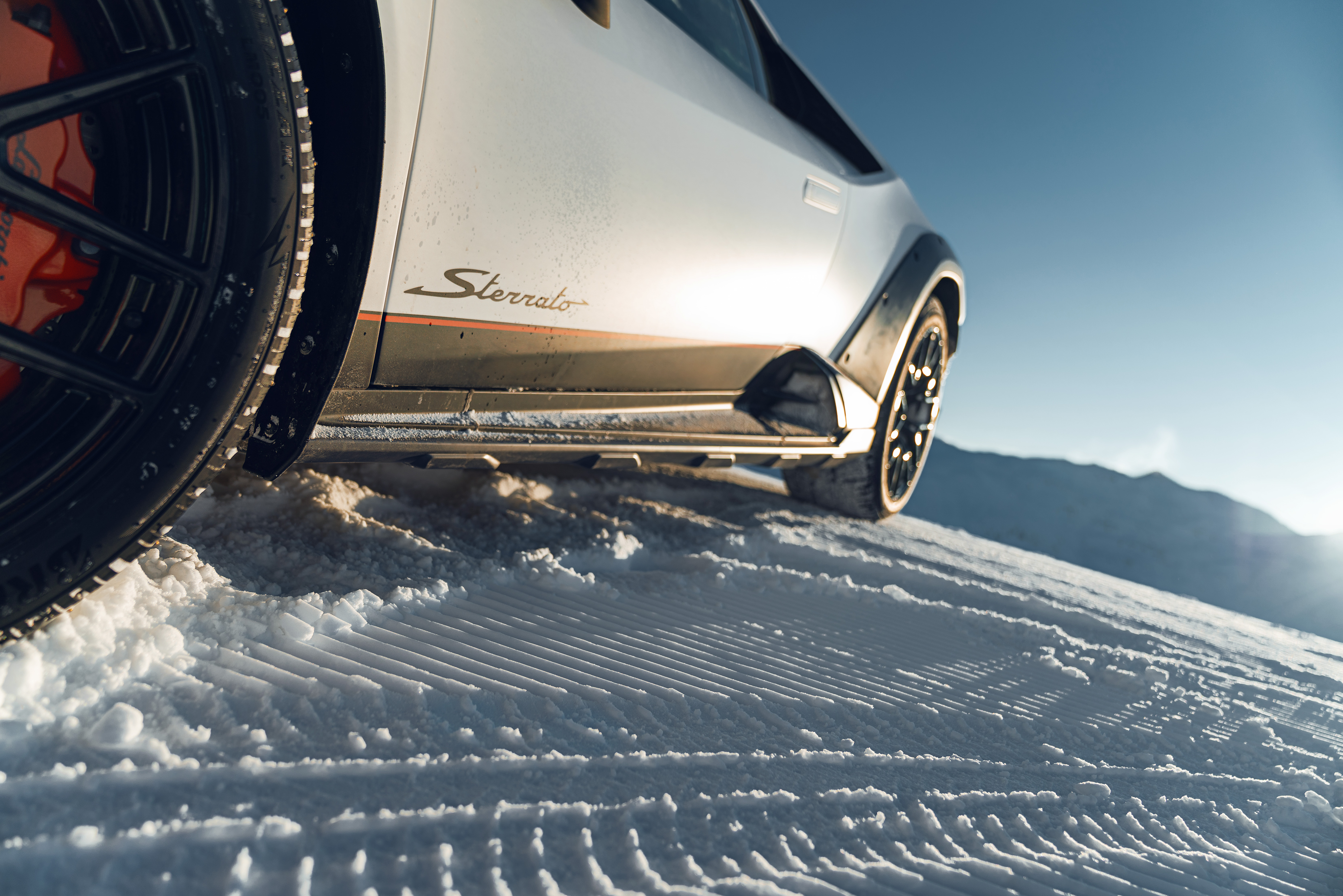 A stunning Lamborghini Huracán Sterrato in a high definition desktop wallpaper displaying a sleek and powerful supercar.