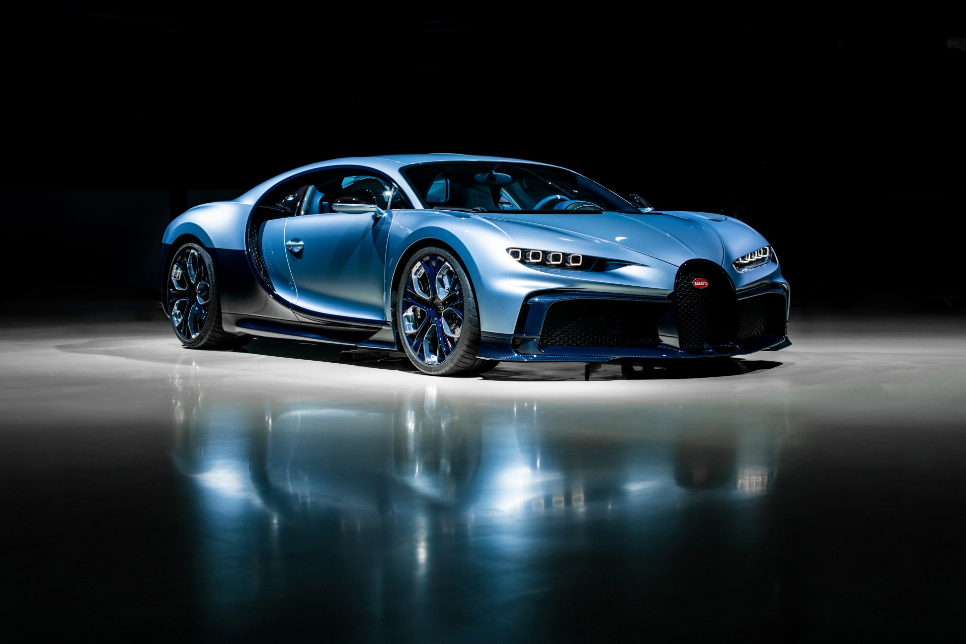 A sleek Bugatti Chiron sports car showcased against a dark background, captured in stunning 4K Ultra HD for a PC desktop wallpaper.