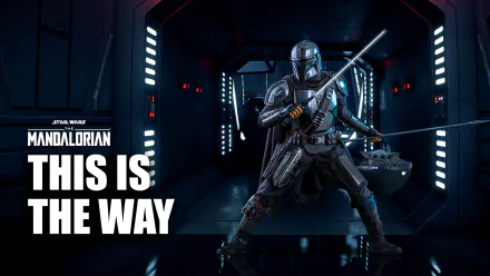 4K Ultra HD PC desktop wallpaper: The Mandalorian (TV Show) — armored warrior in a dark spaceship corridor wielding blade and blaster, This Is The Way text, mandalorian war motif.