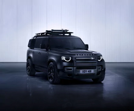 Matte black Land Rover Defender SUV in a minimal studio, high-detail 8K Ultra HD PC desktop wallpaper and background.
