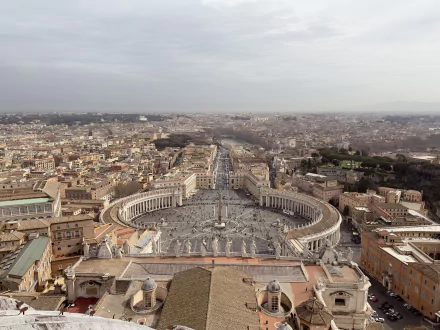 Aerial view of St. Peter's Basilica and St. Peter's Square in Vatican City, Italy, captured in stunning 8K Ultra HD detail showcasing the iconic man-made city landmark.