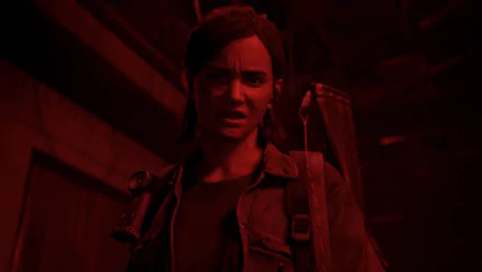 Ellie (The Last of Us) in red lighting, tense with a backpack and weapon over her shoulder — 4K Ultra HD PC desktop wallpaper.