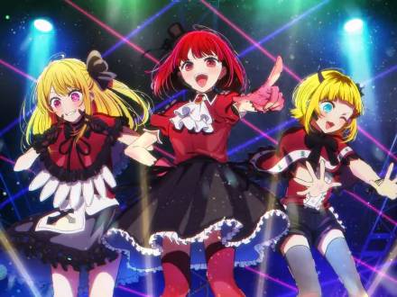 HD desktop wallpaper featuring anime characters Mem-Cho, Kana Arima, and Ruby Hoshino from Oshi no Ko, posing energetically on stage with vibrant colored lights in the background.