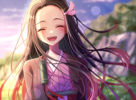 HD desktop wallpaper features Nezuko Kamado from the anime Demon Slayer: Kimetsu no Yaiba. She is smiling brightly with long hair flowing in a scenic background.