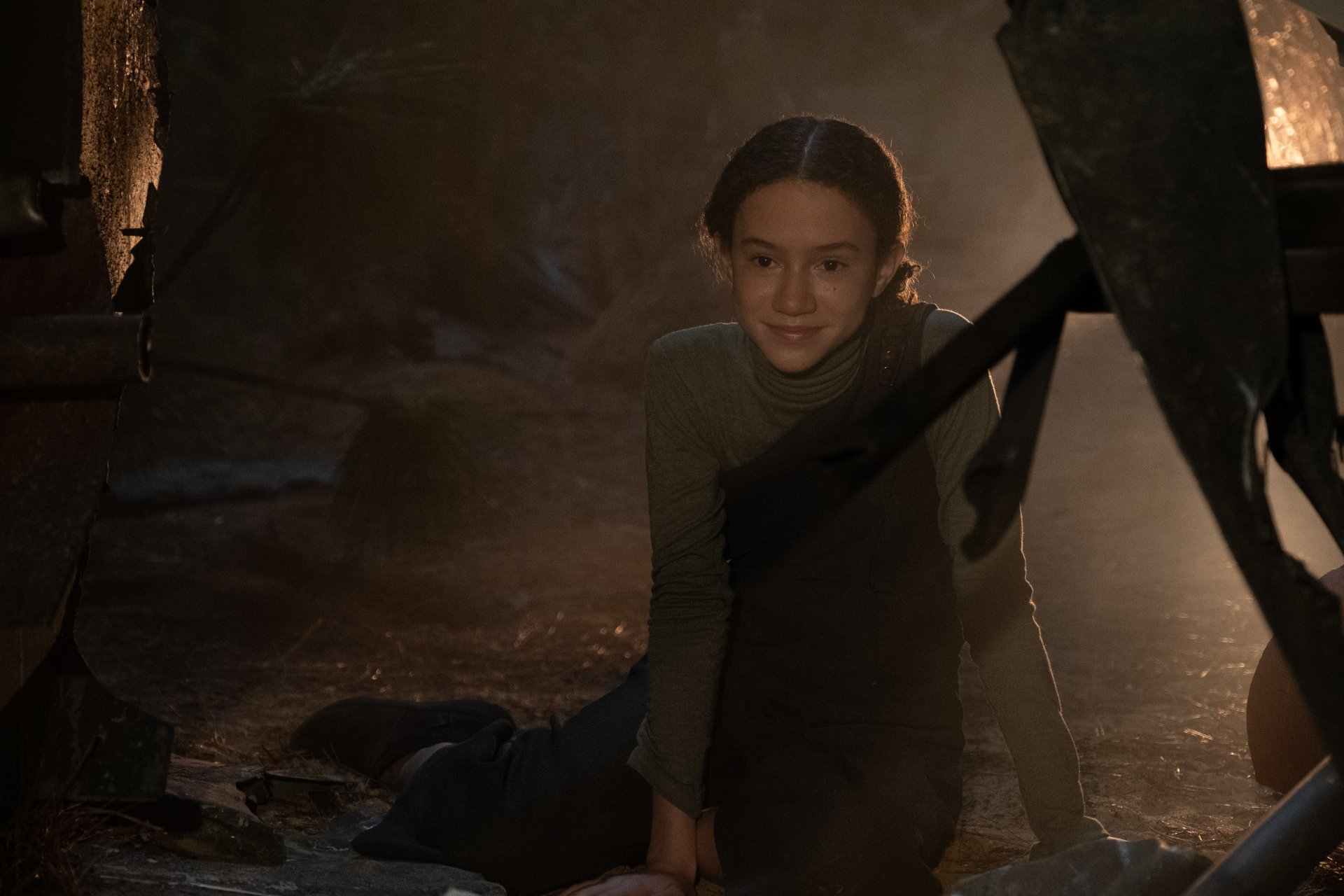 HD desktop wallpaper featuring a young girl peeking from behind a dark, rugged structure in a mysterious setting, tagged with #65 for a captivating background theme.