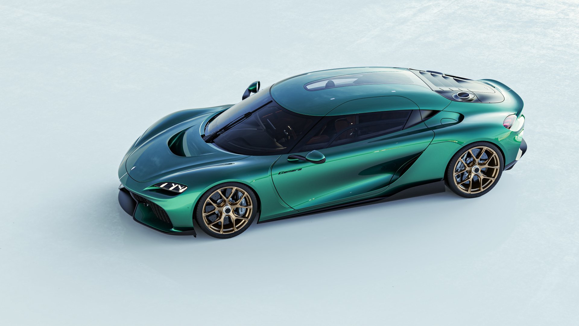 A stunning Koenigsegg Gemera showcased in vibrant green, set against a sleek background, making a striking HD desktop wallpaper and background.