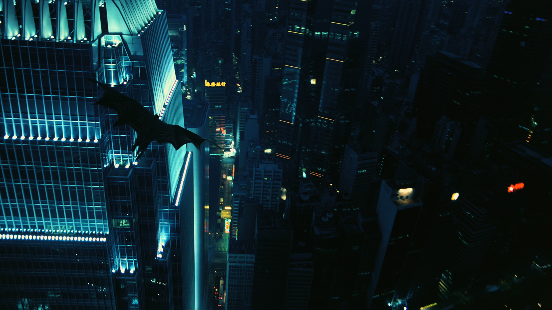 HD PC wallpaper featuring a dark cityscape with Batman soaring, inspired by Christopher Nolan's The Dark Knight comic superhero theme.