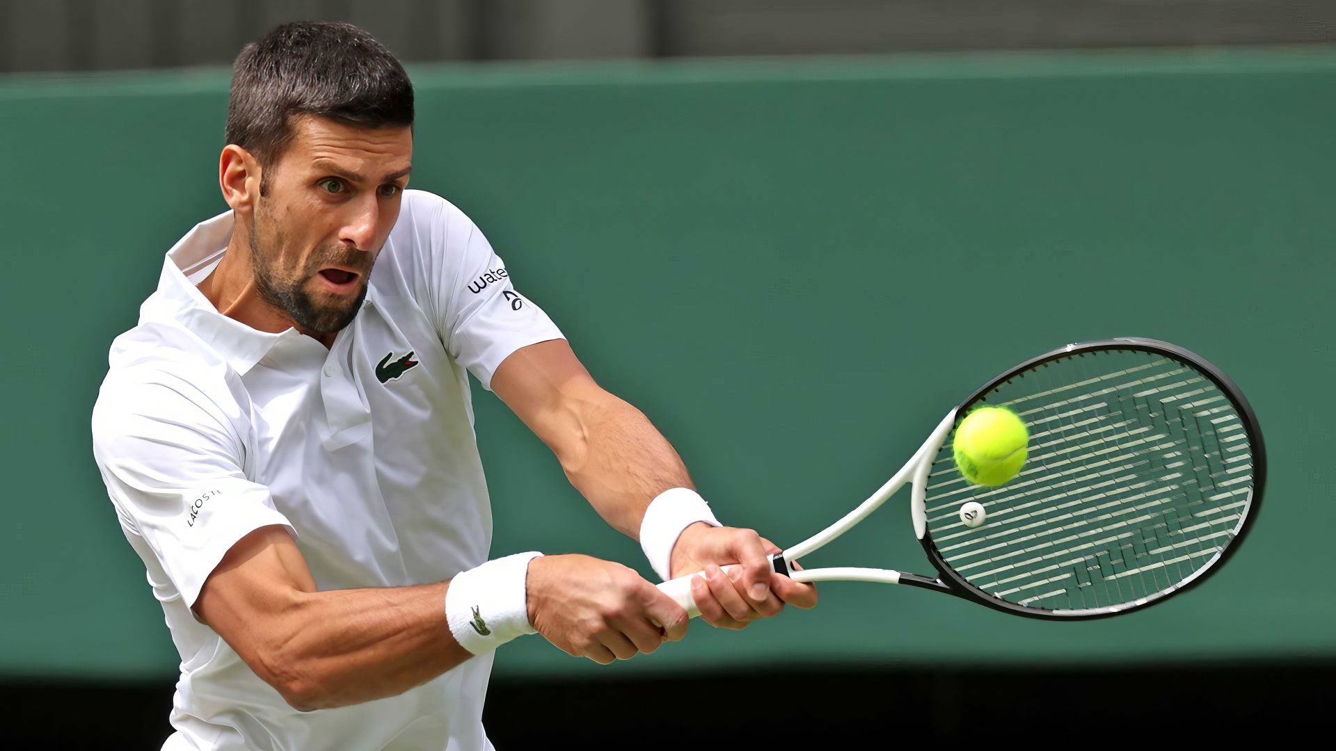 Tennis player in white at Wimbledon 2023 delivering a powerful backhand shot - HD desktop wallpaper.