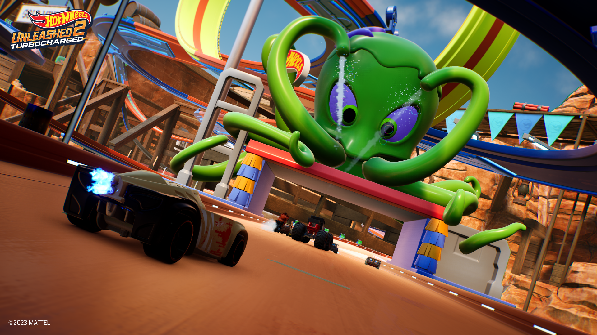 HD wallpaper from Hot Wheels Unleashed 2: Turbocharged featuring a thrilling race with cars dodging a giant green octopus on a vibrant track.