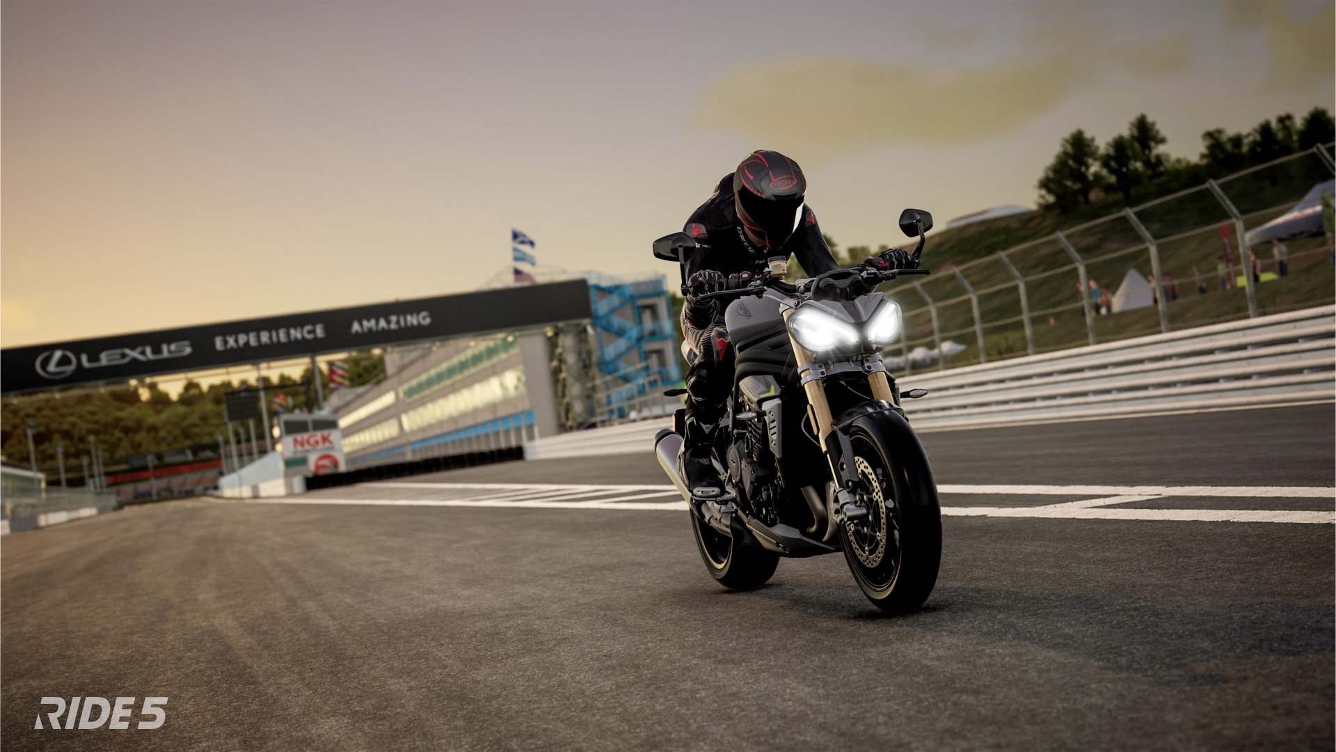 HD desktop wallpaper of a motorcycle racer cornering on a track in the video game Ride 5.