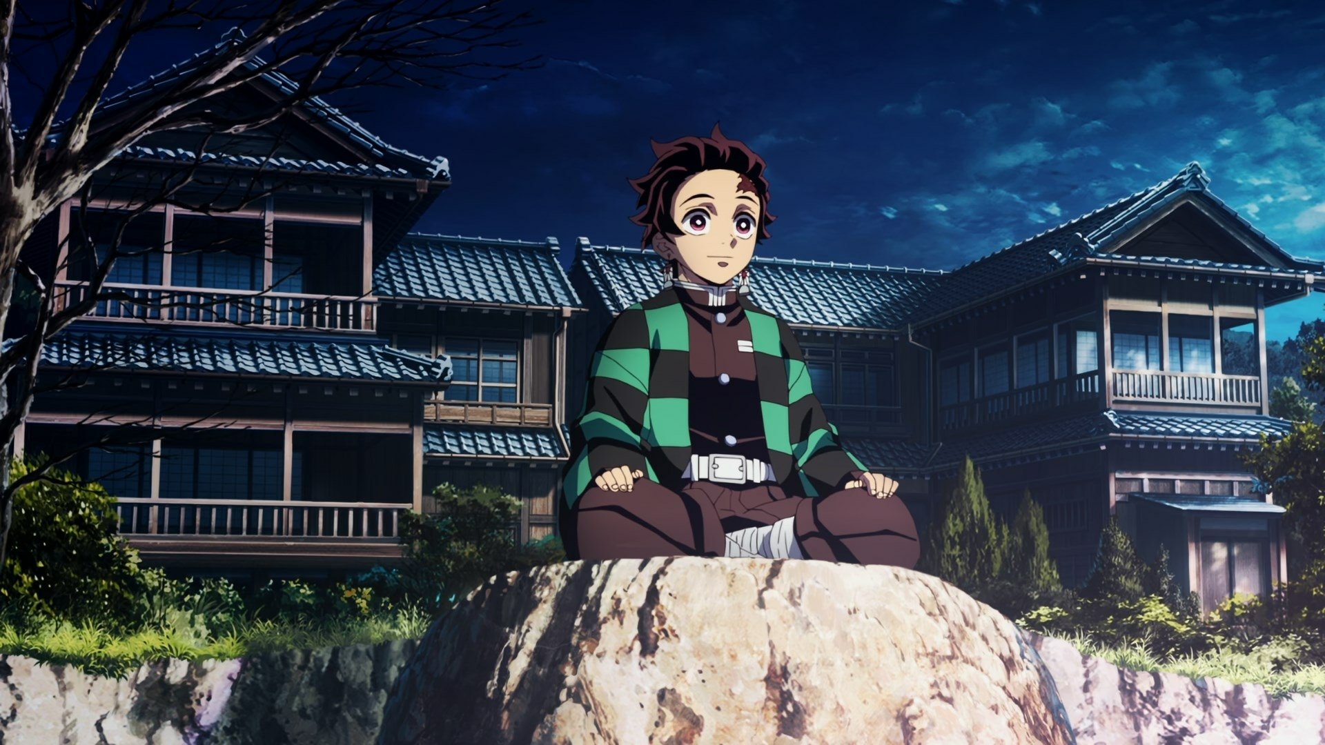 HD desktop wallpaper featuring a scene from Demon Slayer: Kimetsu no Yaiba, with a character sitting on a rock in front of a traditional Japanese house under a night sky.