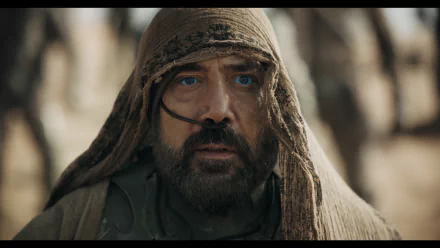 Javier Bardem in a dramatic moment from Dune: Part Two, featuring his intense gaze and textured attire, captured in this striking HD wallpaper.