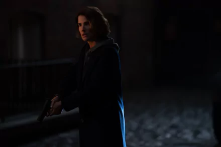 HD desktop wallpaper featuring a mysterious figure from Secret Invasion standing in a dimly lit alley, evoking an atmosphere of intrigue and suspense.