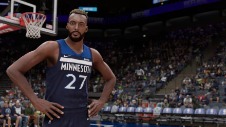 HD desktop wallpaper featuring a basketball player from NBA 2K23 game, in a Minnesota Timberwolves jersey, standing on the court with stadium background.