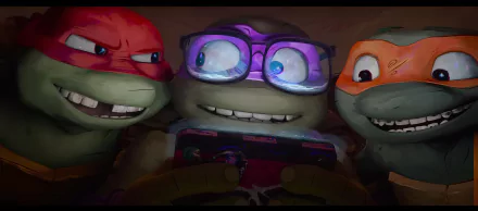 Three Teenage Mutant Ninja Turtles share a joyful moment, engrossed in a game on a phone. This vibrant image from Teenage Mutant Ninja Turtles: Mutant Mayhem serves as an engaging HD desktop wallpaper.