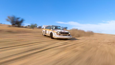 Forza Horizon 5 video game HD PC desktop wallpaper: vintage rallye car racing across sunlit desert dunes, kicking up a dust trail with motion blur and a bright blue sky.