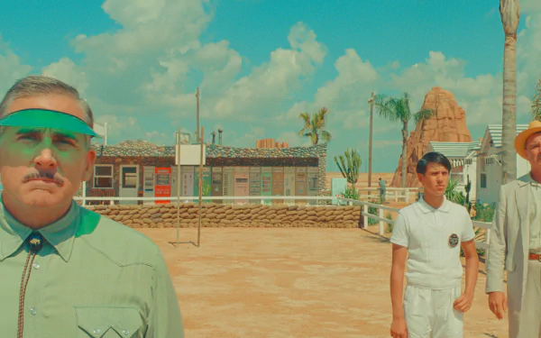 HD desktop wallpaper featuring a stylized depiction of Asteroid City with individuals in unique costumes against a retro-futuristic backdrop with palm trees and a clear sky.