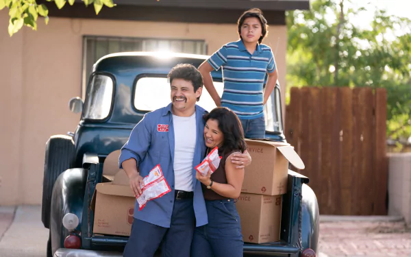 Happy family with Flamin' Hot snacks standing by vintage truck, HD desktop wallpaper background.