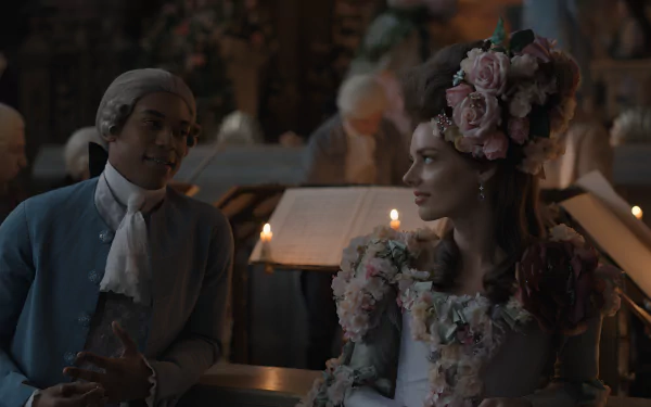 HD wallpaper of a chevalier-themed scene with two elegantly dressed individuals, one wearing a floral headdress, in a candlelit historical setting.