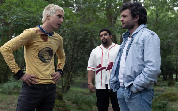 HD wallpaper featuring three people in a forest scene, relating to the concept of Cocaine Bear, with one person looking intently at another.