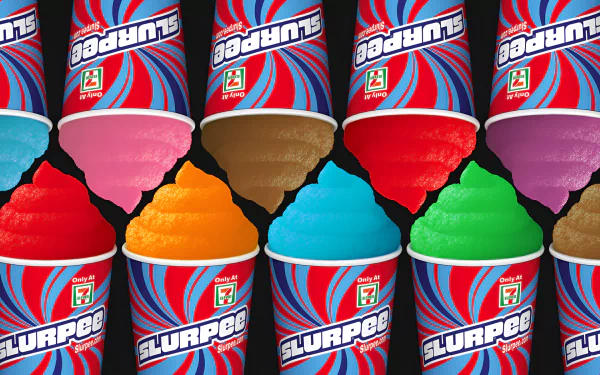 Colorful Slurpee cups in a row with vibrant frozen drink flavors for desktop wallpaper.