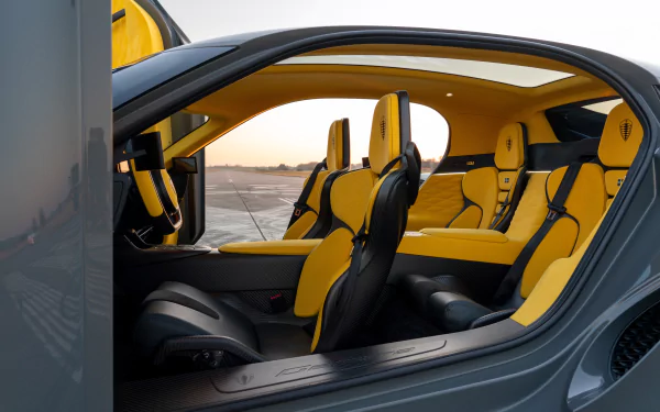 Koenigsegg Gemera interior showing luxurious yellow seats, serving as a high-definition desktop wallpaper.